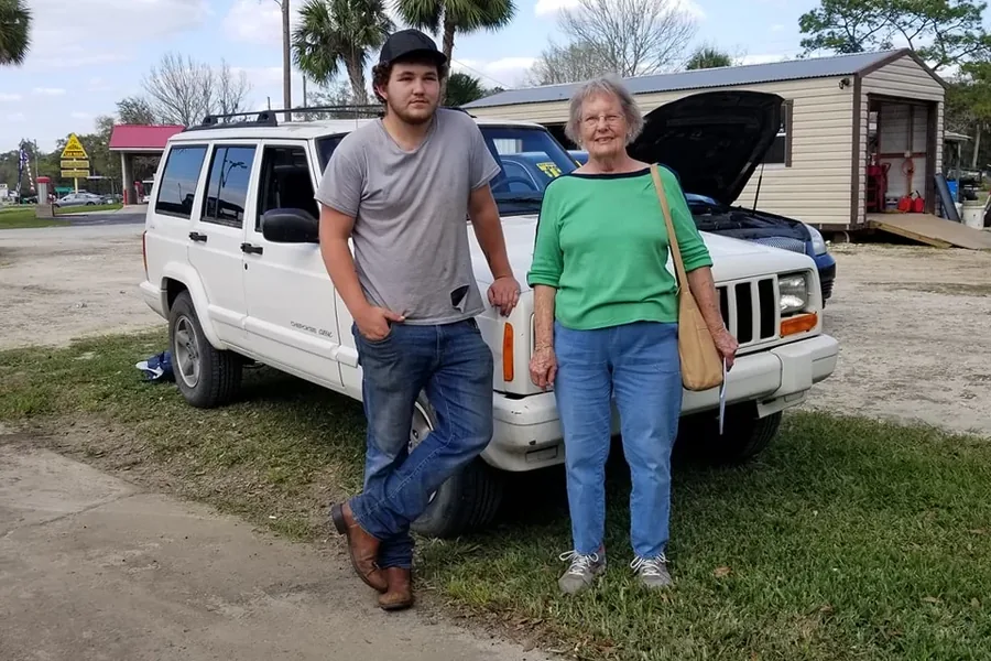 A happy Myhree Motors customer with their vehicle